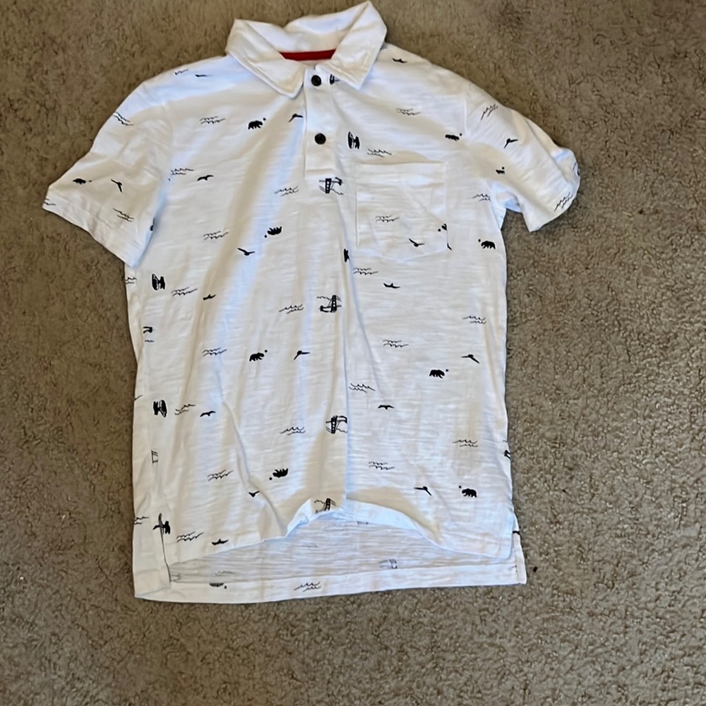 White collared shirt with simple black designs